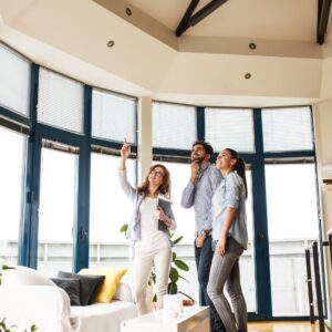 realtor showing a couple a home