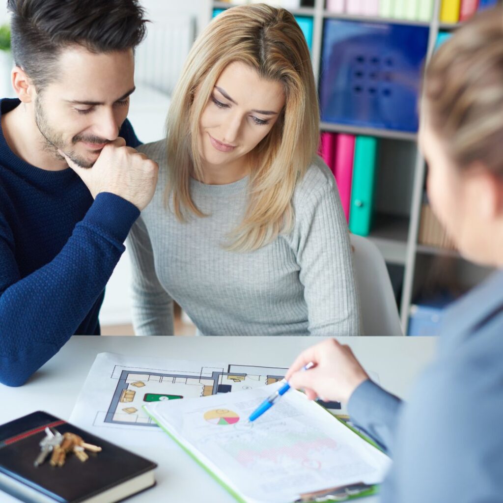 couple speaking with financial lender