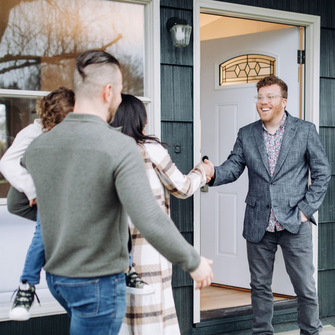 Realtor handshake with family