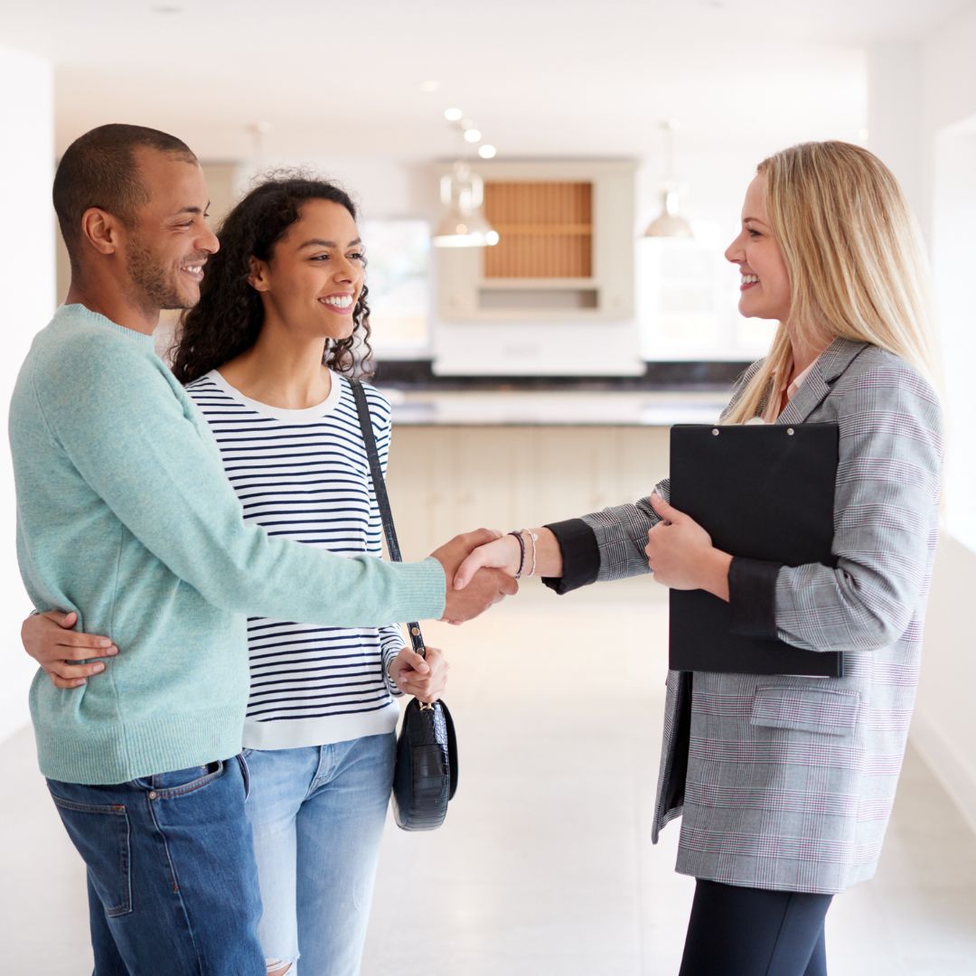 couple meeting with realtor