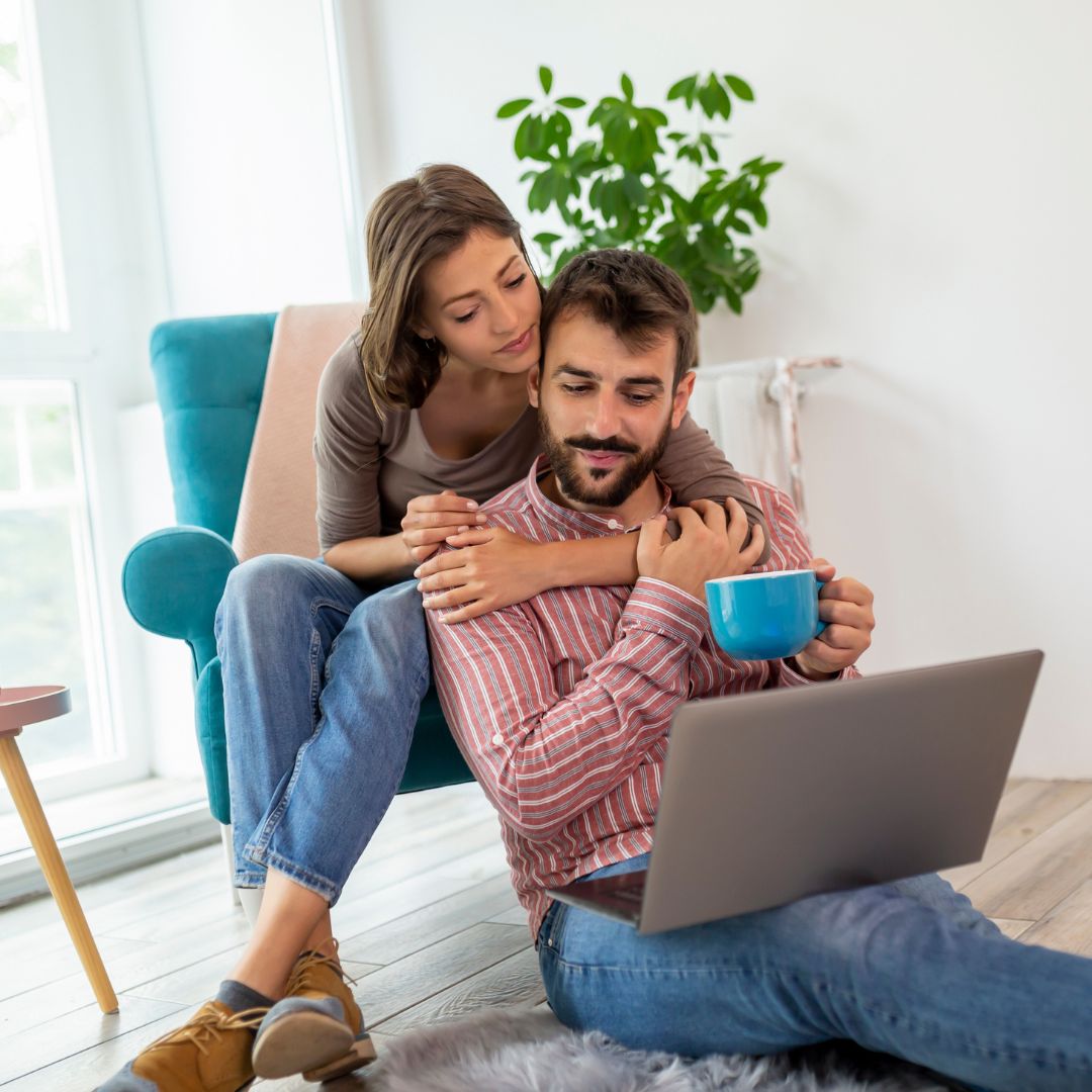 young couple on laptop