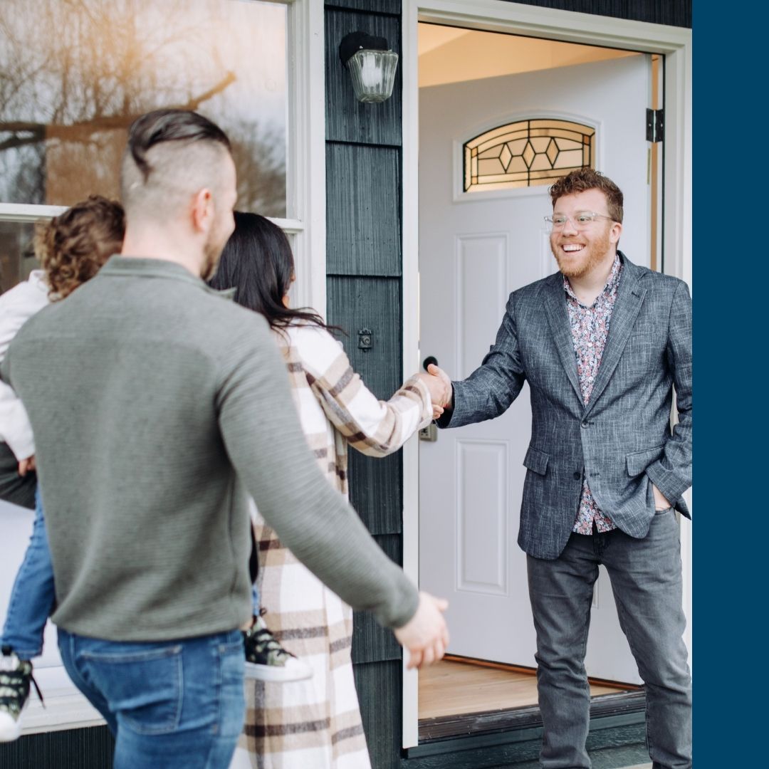 real estate agent greeting clients