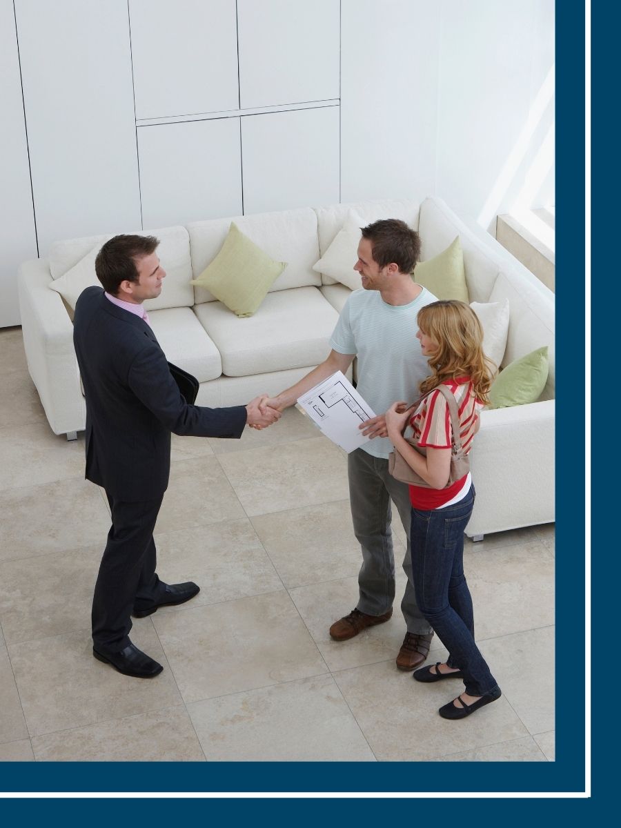 real estate agent shaking a client's hand