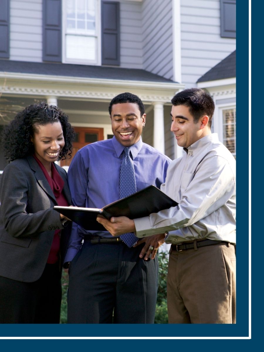 real estate agent showing a couple a home