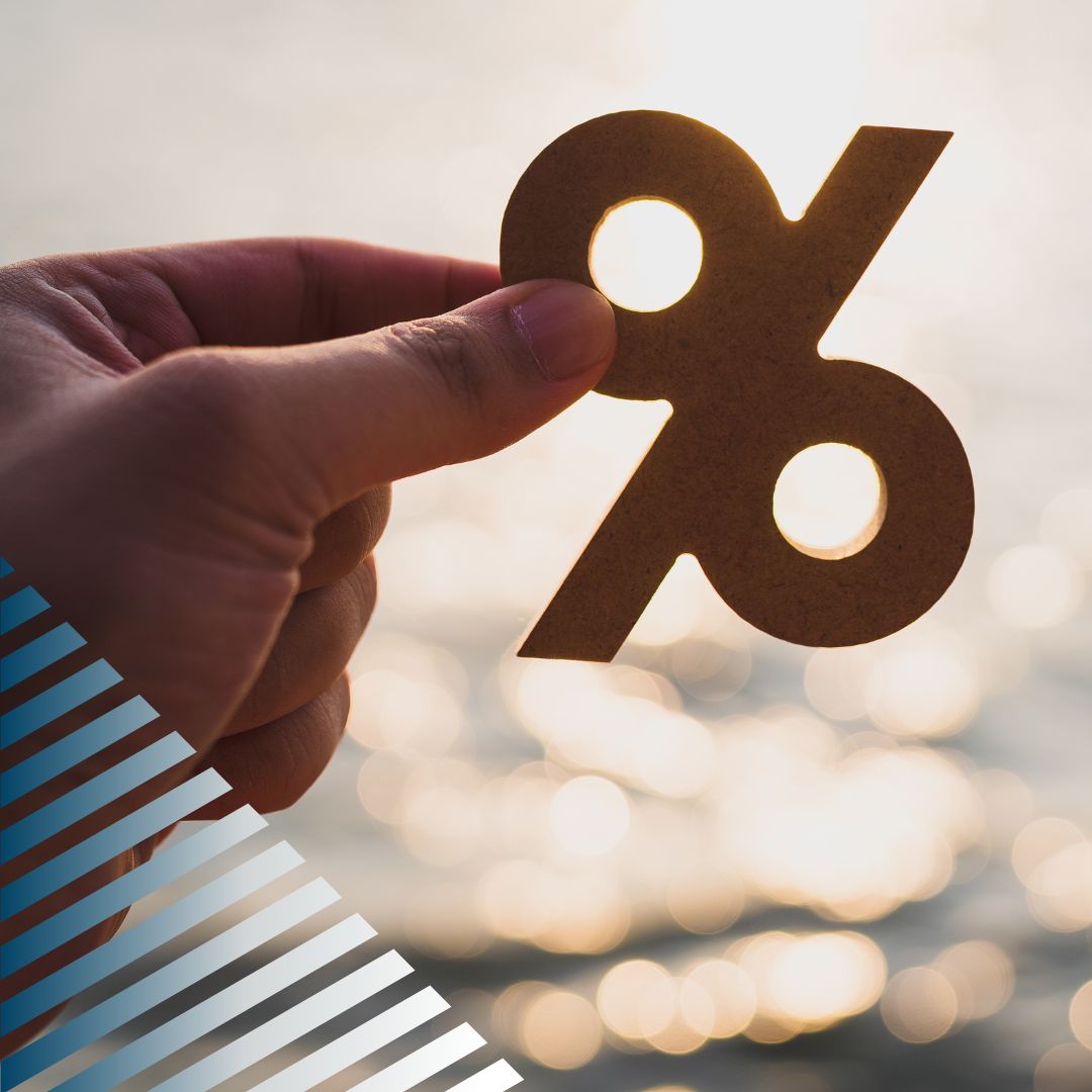 person holding percentage sign