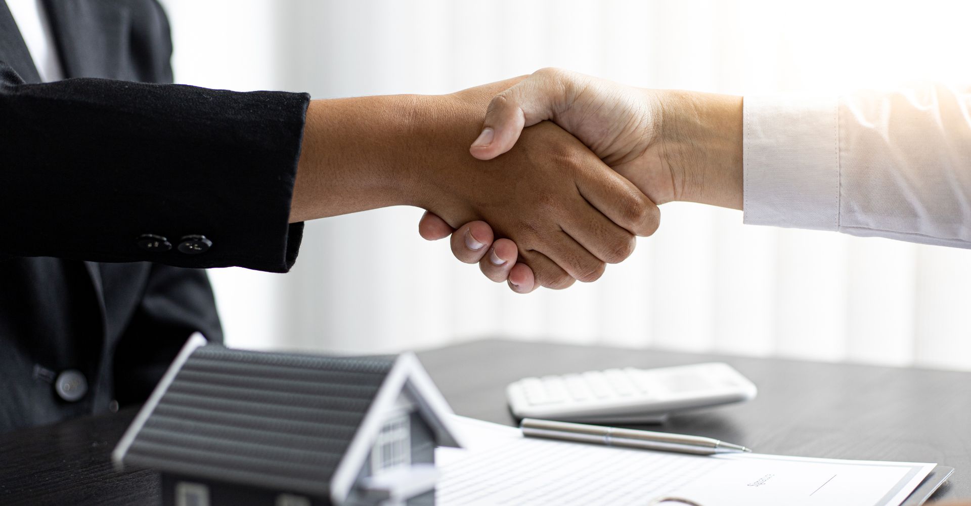 realtor shaking hands with client