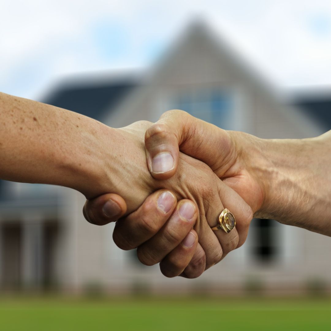 shaking hands after home sale