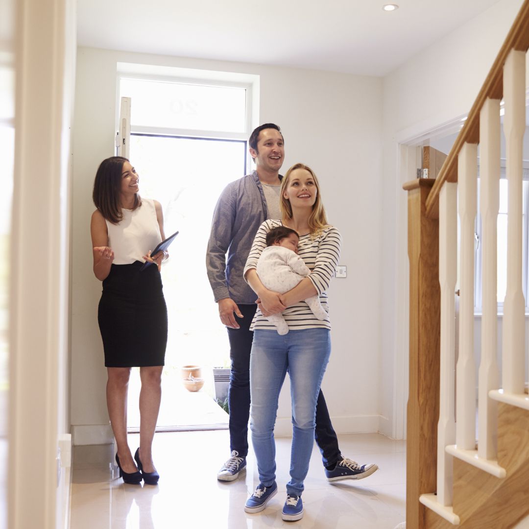 realtor showing home to family